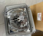 Đèn pha Isuzu NQR 400 NPR 550 3,5 tấn 5 tấn chính hãng 